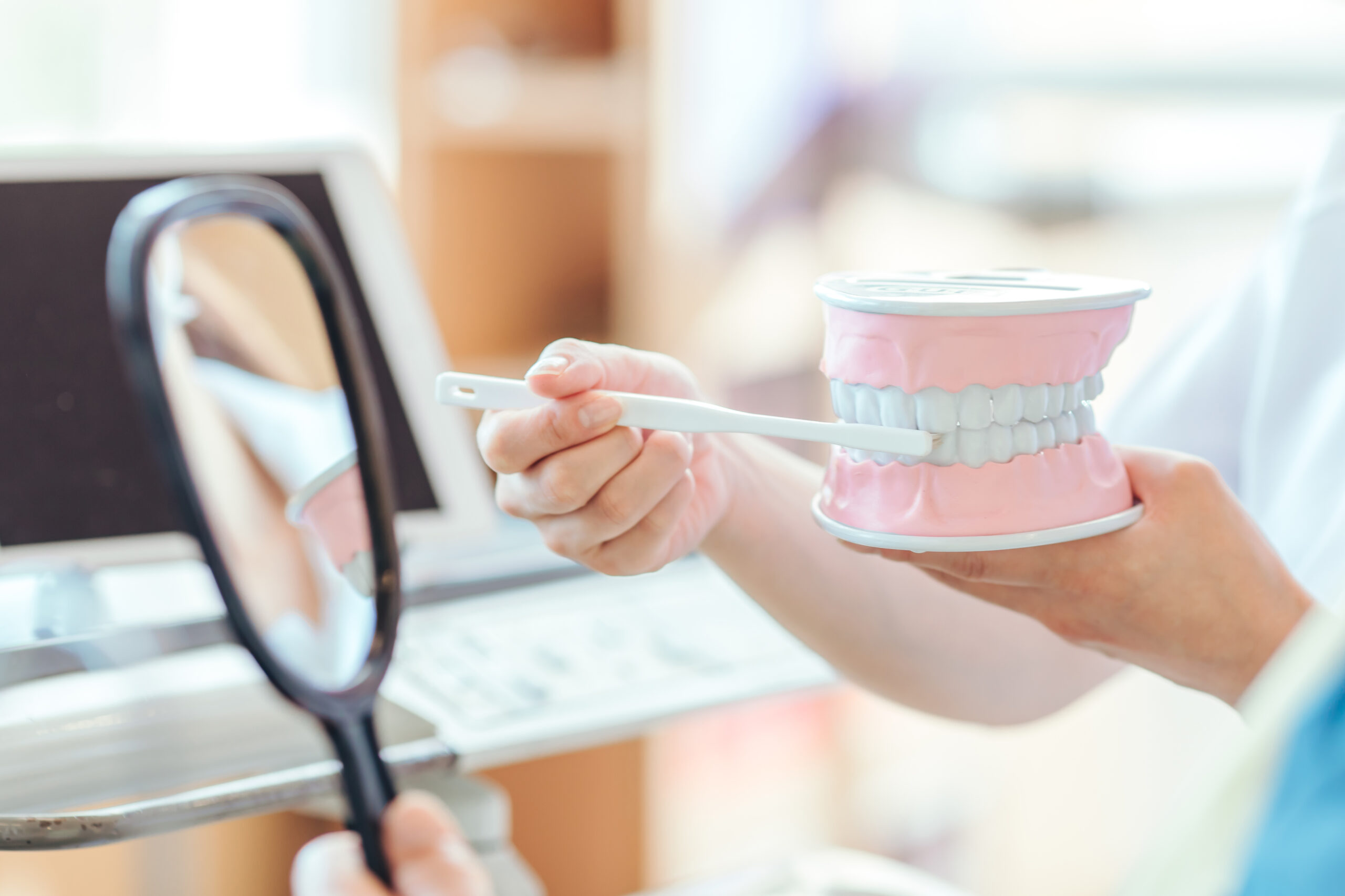 Dental hygienist and male patient